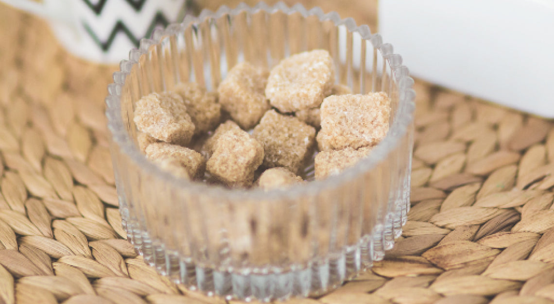 Ant on kitchen counter next to laptop representing freelancer missing deadline with absurd excuse