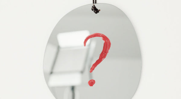 Question mark on white background representing difficult customer situation and refund pressure