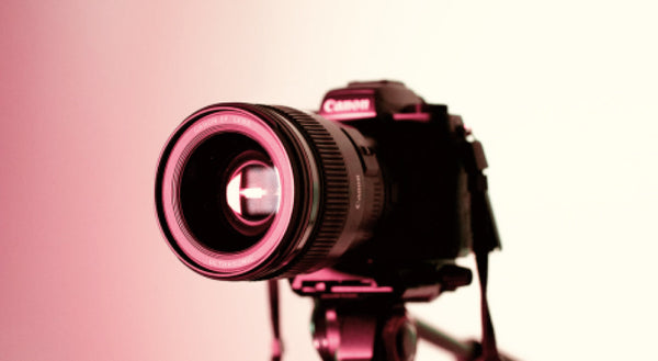 Camera and spotlight representing Chinese influencer content style and conversion on Xiaohongshu